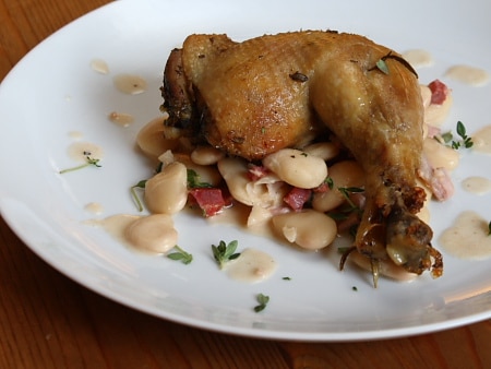 Confit chicken legs with butter beans and chorizo stew